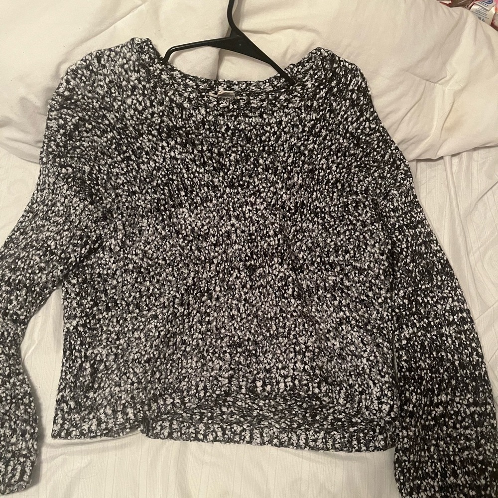 grainy black and white sweater